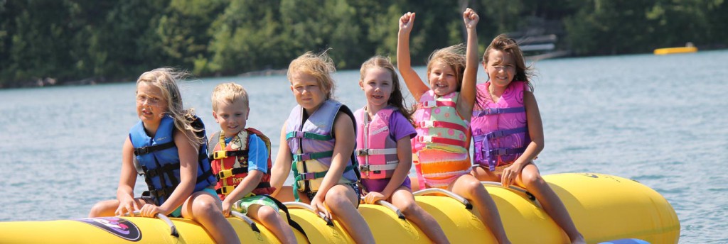 Children on banana tube